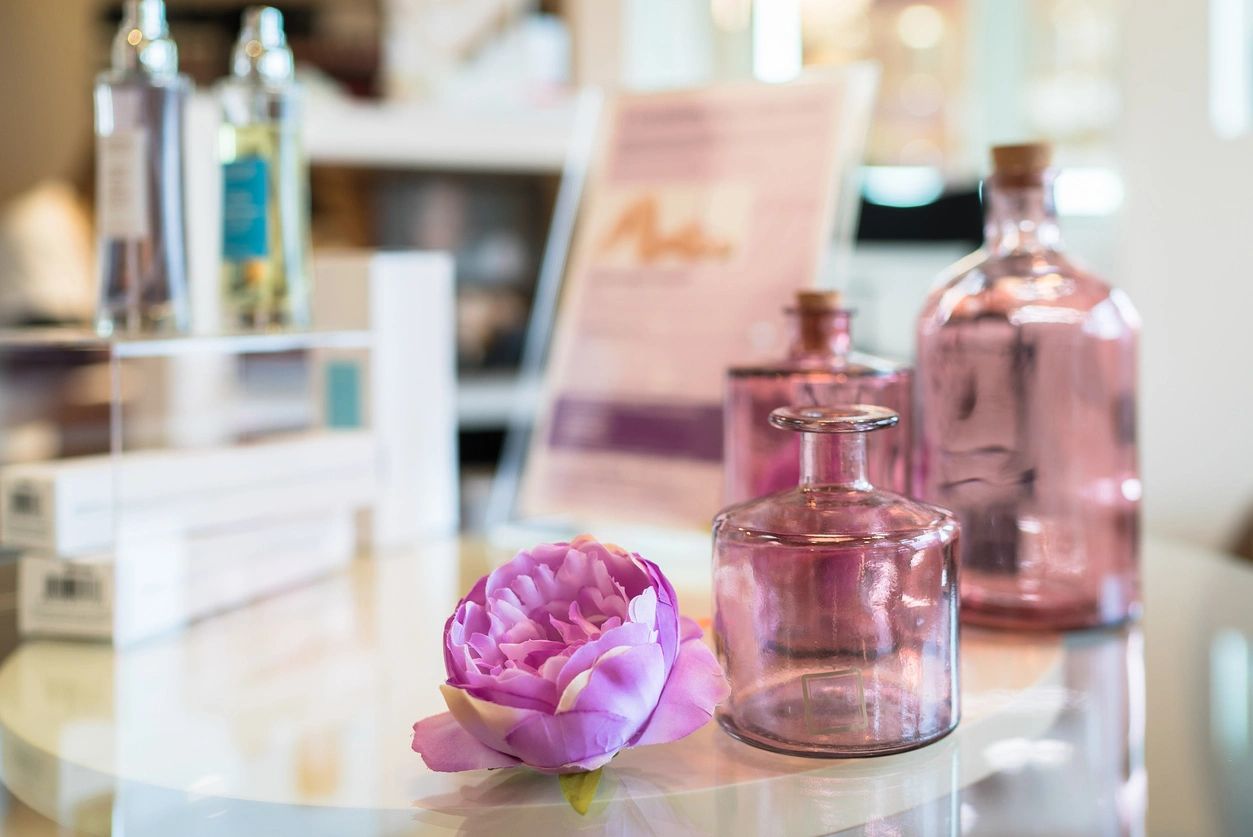 Multiple perfume bottles used to layer perfume